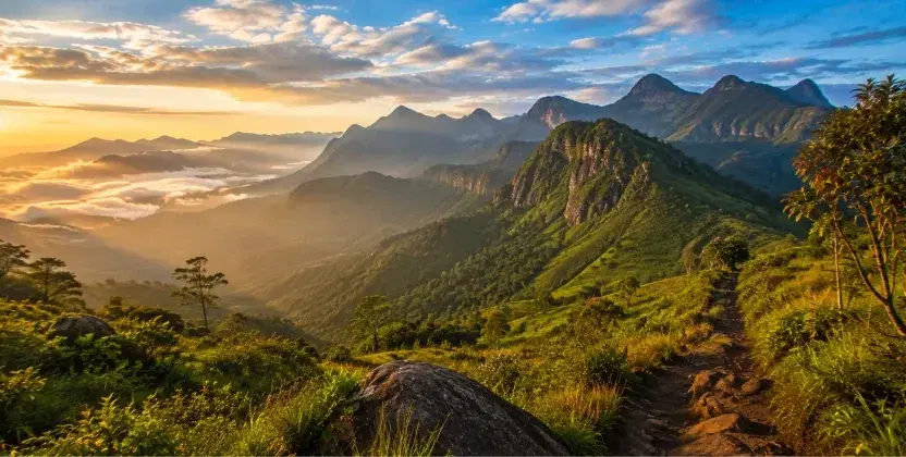 Places to visit in Sri Lanka: Knuckles Mountain Range with misty peaks, green valleys, and hiking trails.