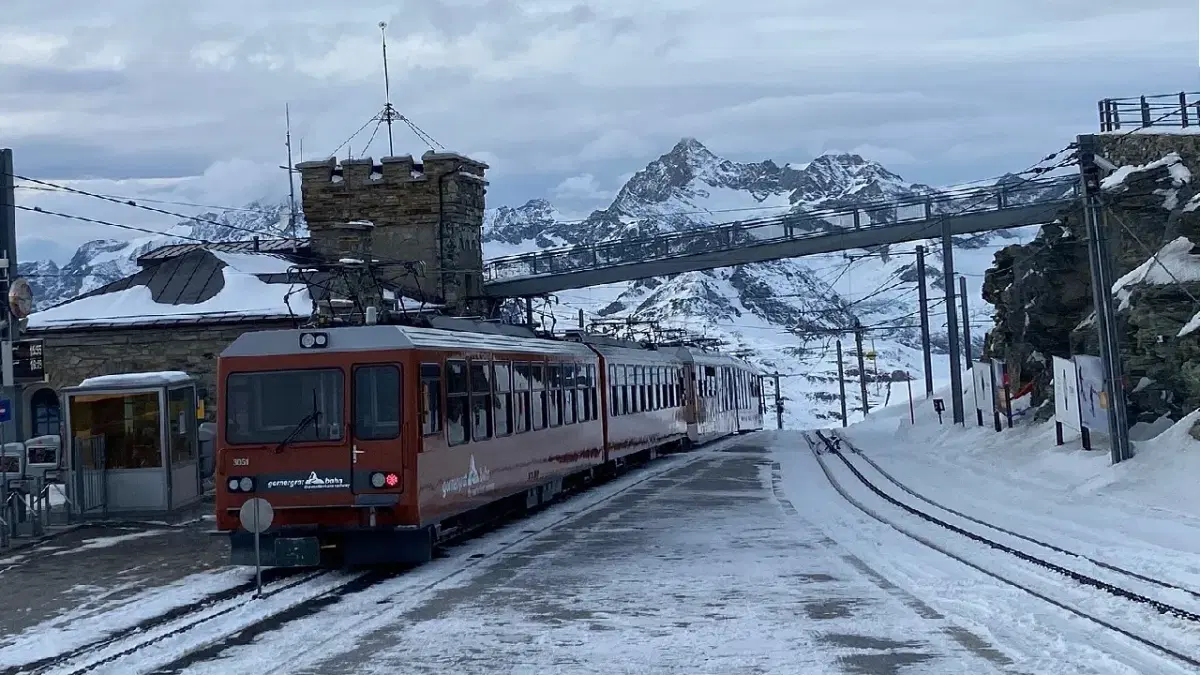 view of gornergrat train with swiss alpine ranges at the background