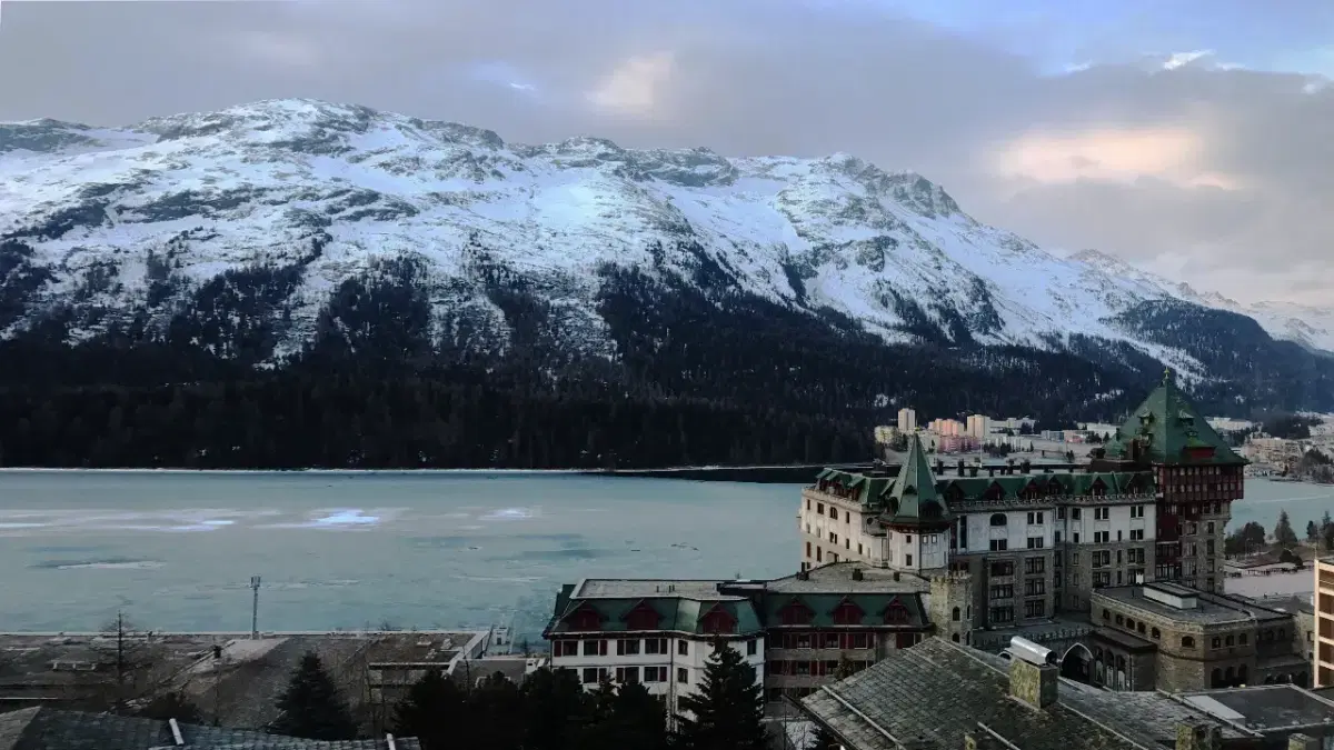 View of frozen lake in St.Moritz with the alpine range at the background
