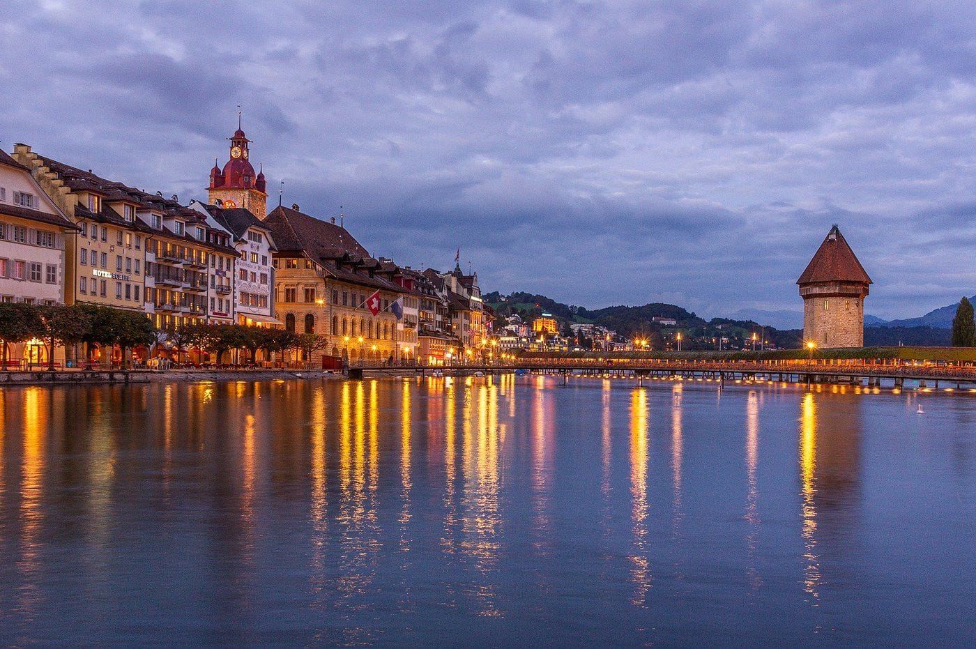 View of Lucerne in Switzerland during evening along with the reflection of lights in the lake