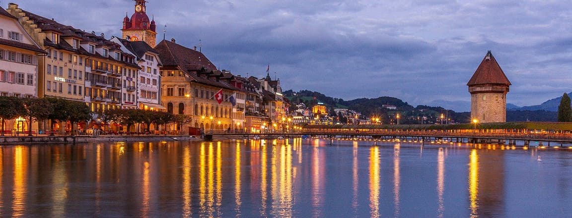 View of Lucerne in Switzerland during evening along with the reflection of lights in the lake