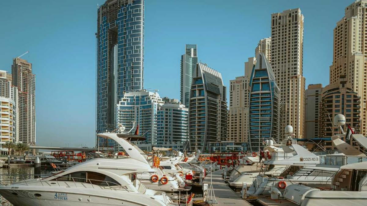 Dubai Marina skyline with yachts docked, representing travel tips for exploring Dubai.