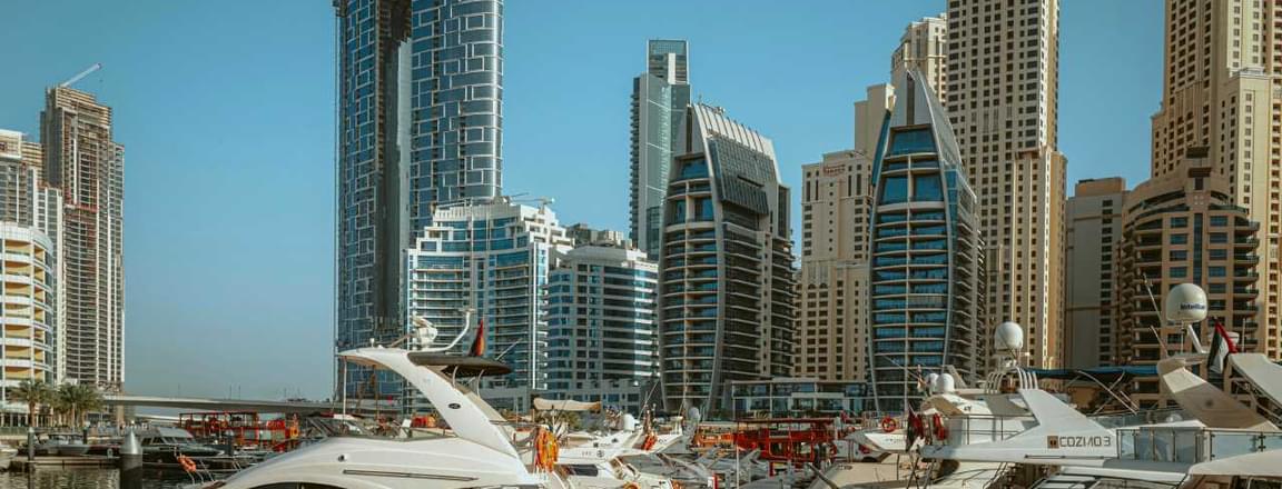 Dubai Marina skyline with yachts docked, representing travel tips for exploring Dubai.