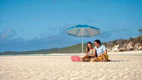 A happy timeout at Whitehaven Beach with a boat-ride on aquamarine waters