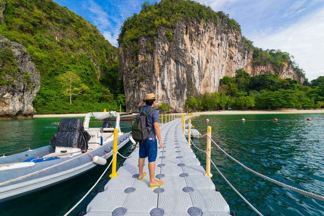 Exploring Hong Island by Longtail boat, on a full-day tour from Krabi with snorkeling and optional kayaking activity