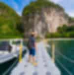 Exploring Hong Island by Longtail boat, on a full-day tour from Krabi with snorkeling and optional kayaking activity