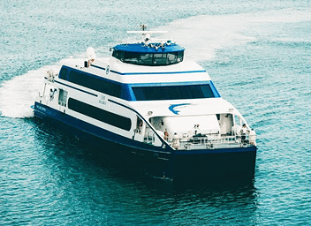 Check out of your hotel. Take the ferry to  Mykonos. Check-in to your new hotel.