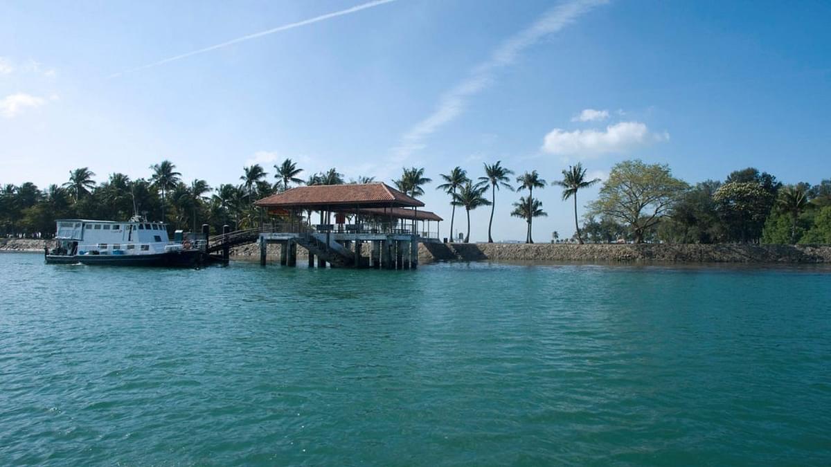 Calm coastal waters and clear skies near diving spots in Singapore, showing typical scuba diving conditions